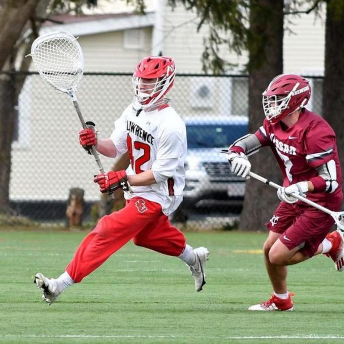 SGS alum and St. Lawrence Lacrosse Player William Helm in a lacrosse game