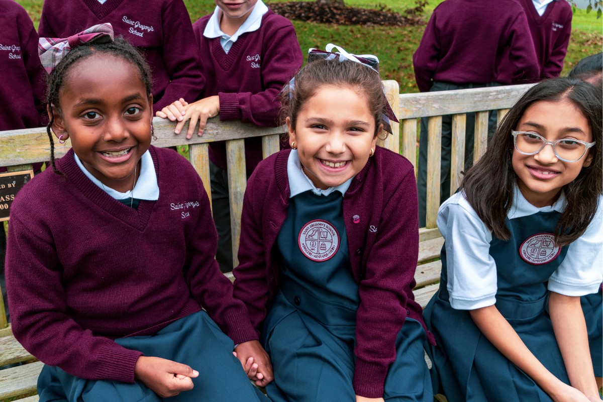 Three private school students smiling in Albany, NY on their first day of school