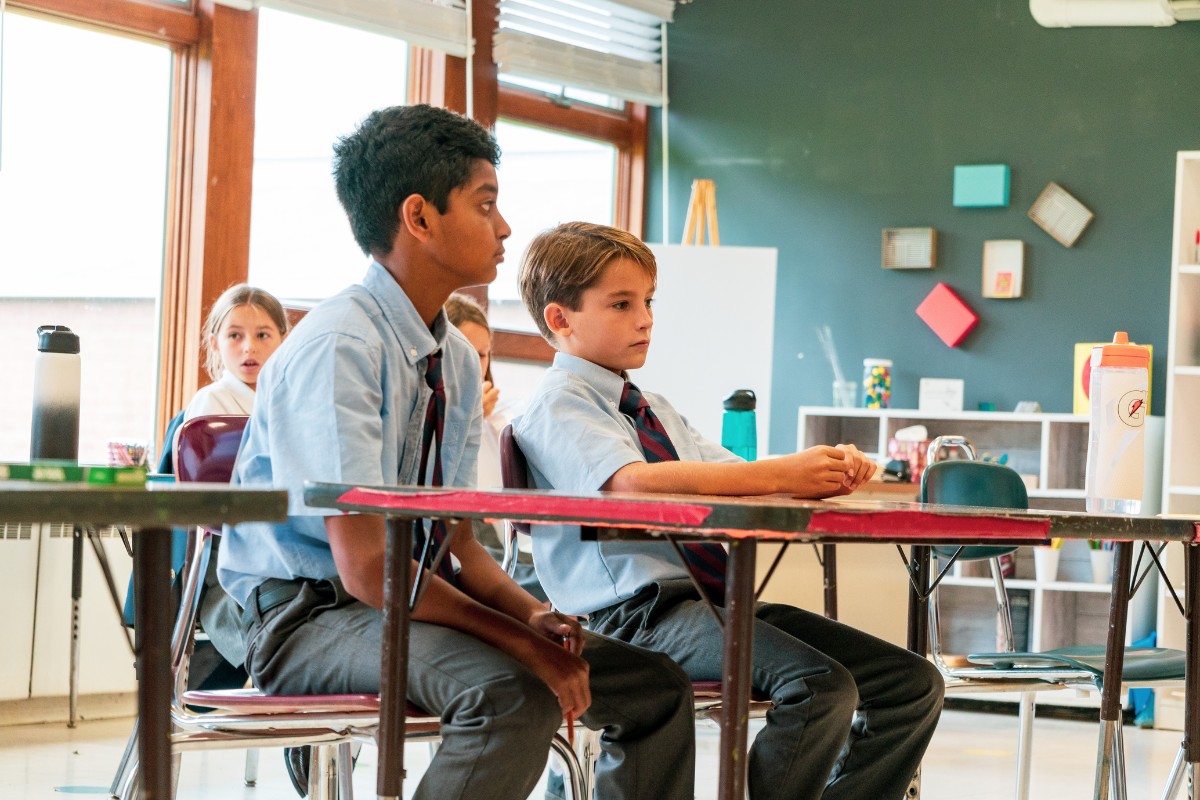 Two boys sitting in their private school classroom during math class