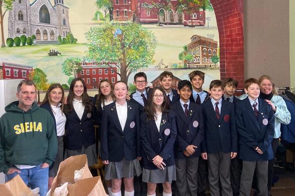 private school students serving at food drive