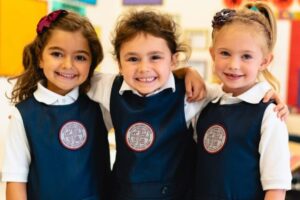 Three private school girls wearing school uniforms