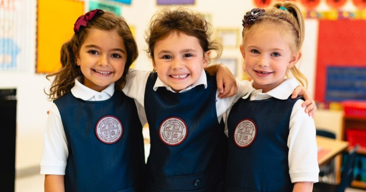 Three private school girls wearing school uniforms