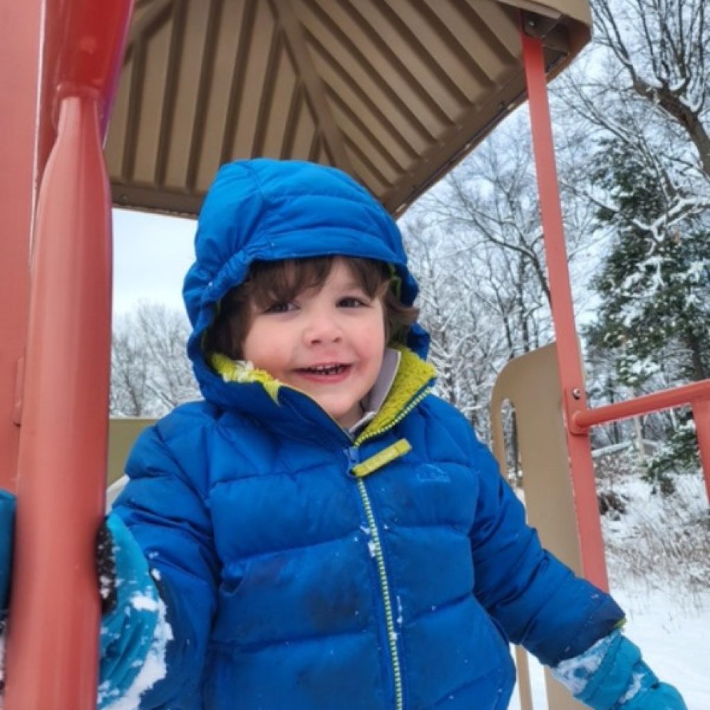 Private School Kindergartener playing in the snow on the Saint Gregory's School Campus in Albany, NY