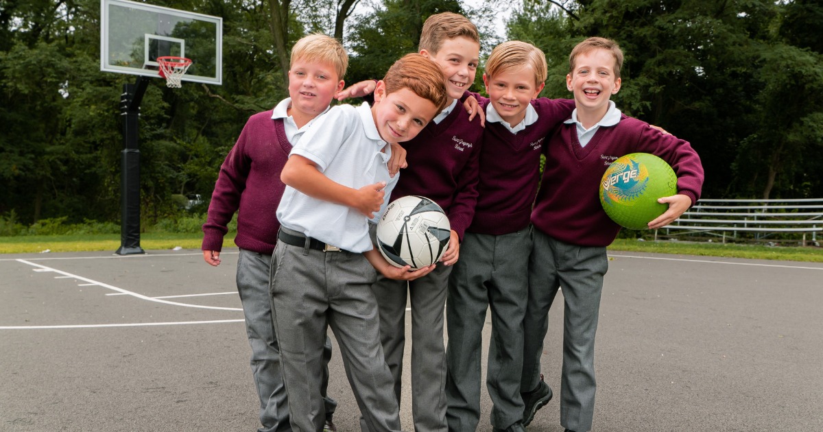 Private School Third Graders playing basketball during recess in Albany, NY