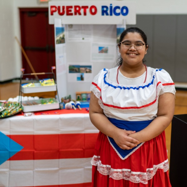 Private school student Khloe set up a table representing Puerto Rico at the SGS Multi-Cultural Fair