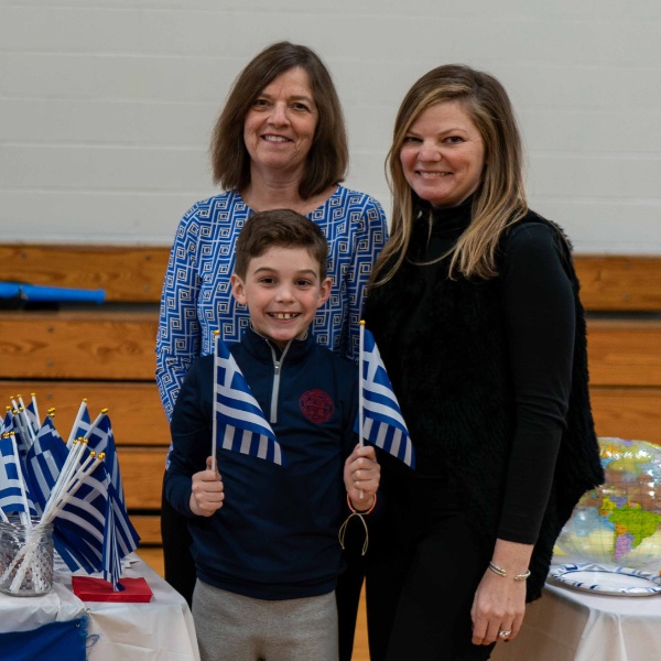 Private school student Ronan set up a table representing Greece at the SGS Multi-Cultural Fair