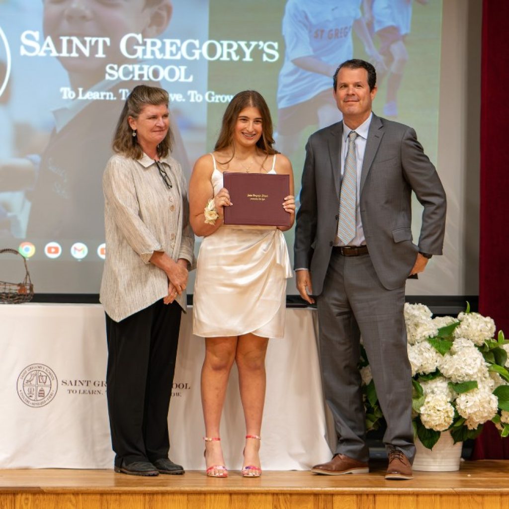 Eight grader receiving her diploma at the Saint Gregory's School graduation