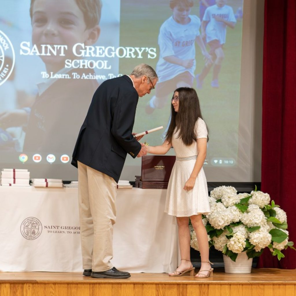 private school 8th grader receiving the Excellence in English award at her graduation