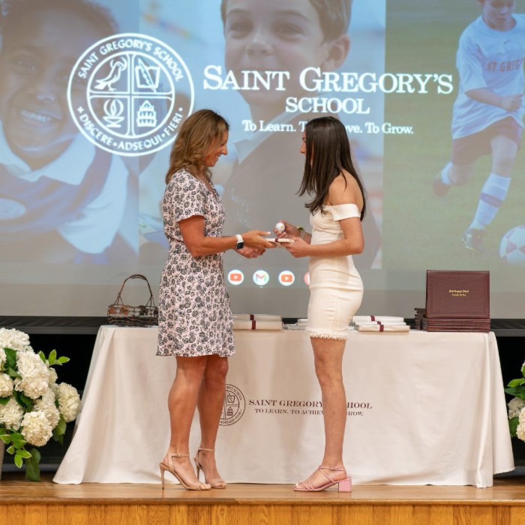 private school 8th grader receiving the Excellence in Spanish award at her graduation