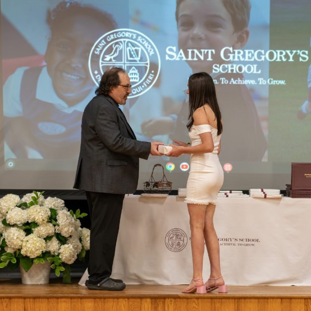 private school 8th grader receiving the Senior Research Paper award at her graduation