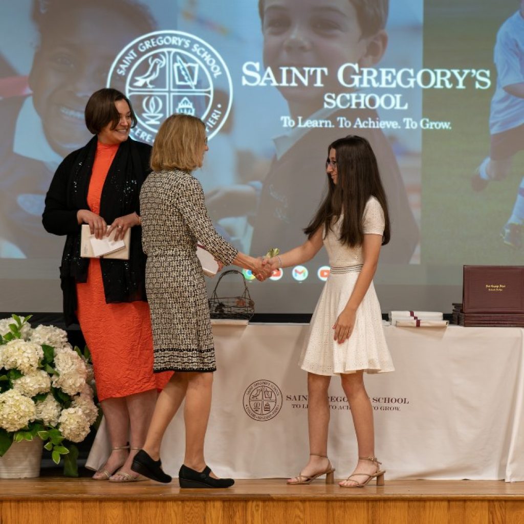 private school 8th grader receiving the Excellence in Art award at her graduation