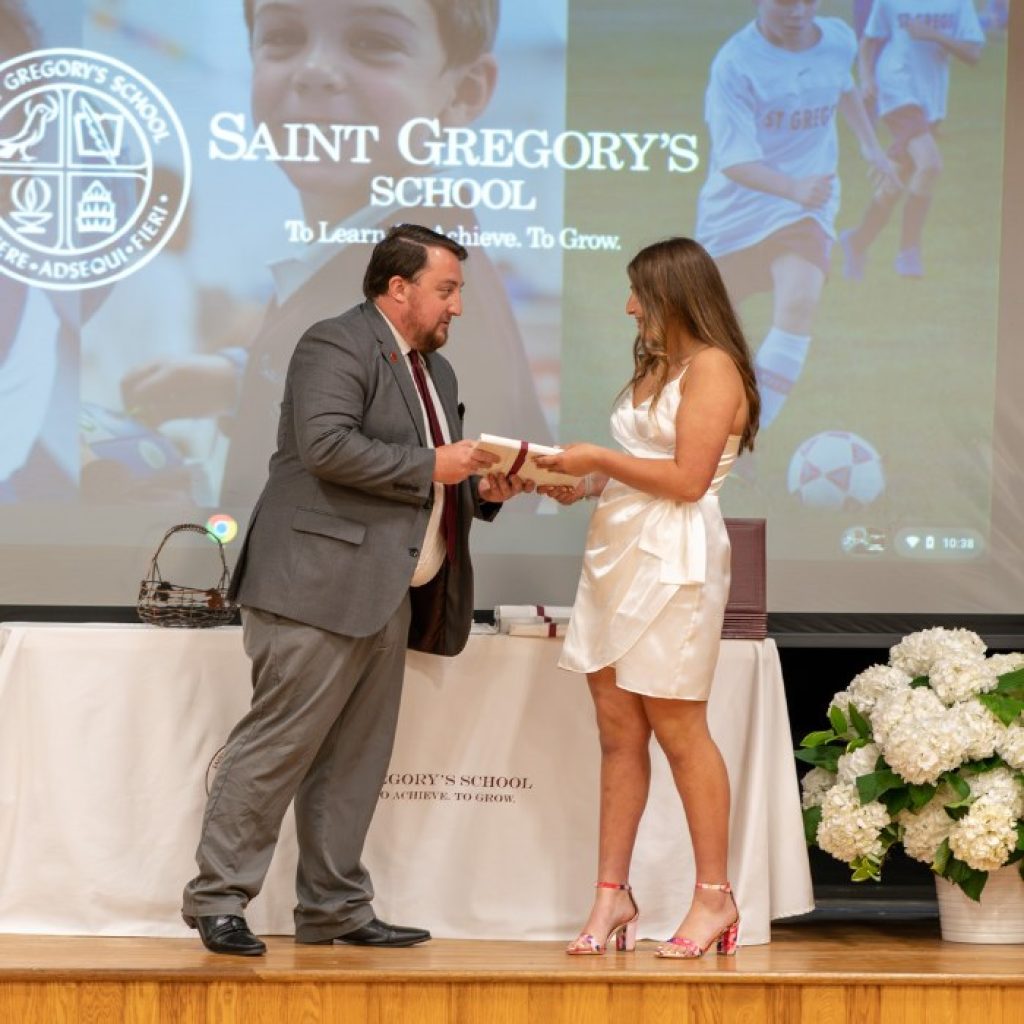 private school 8th grader receiving the Parent's Association award at her graduation