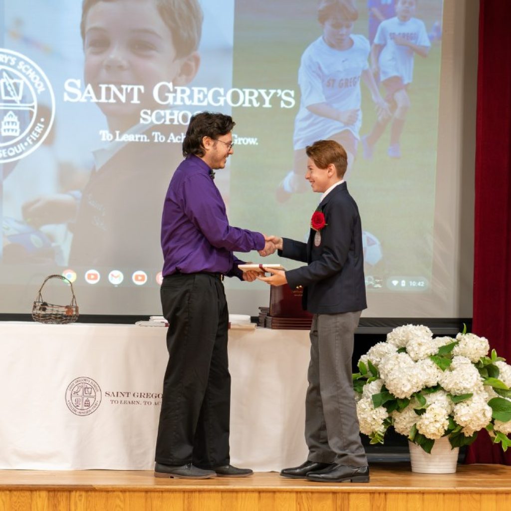 private school 8th grader receiving the Excellence in Science award at his graduation