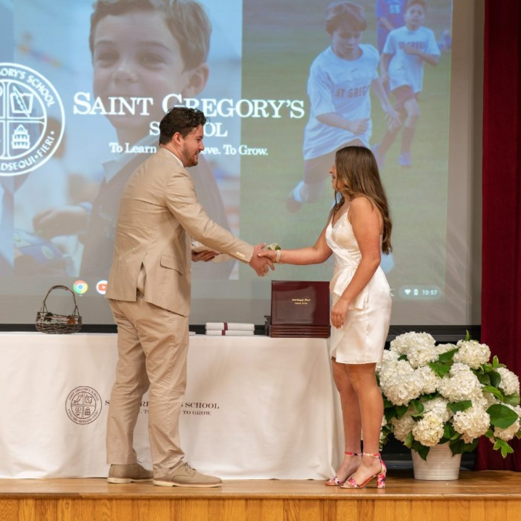 private school 8th grader receiving the Academic Excellence award at her graduation