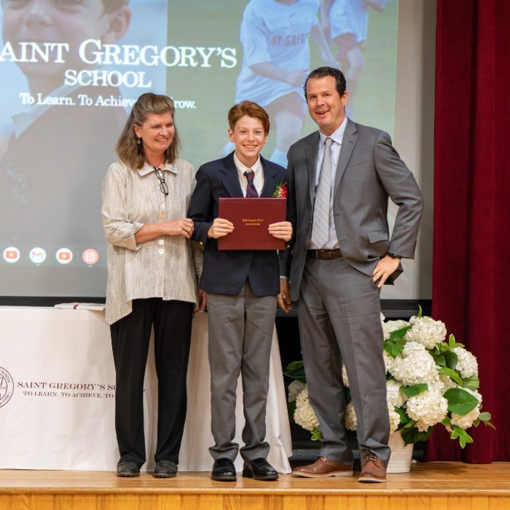 Saint Gregory's student receiving his diploma at graduation