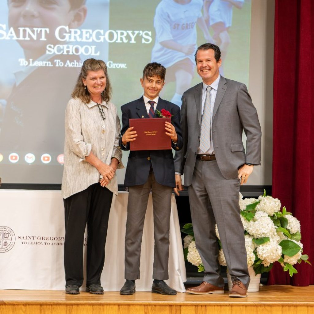 SGS student receiving his diploma at graduation