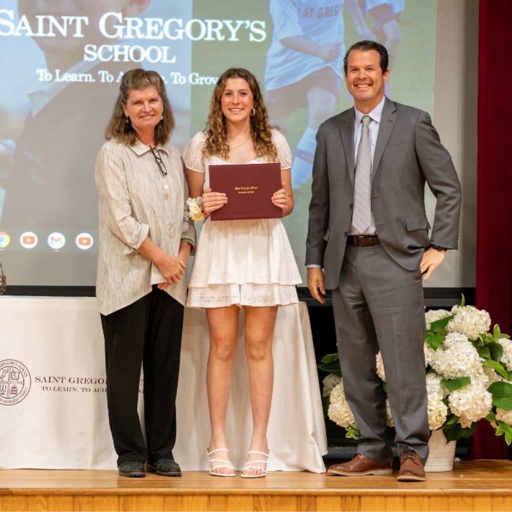 SGS 8th grader receiving her diploma at graduation