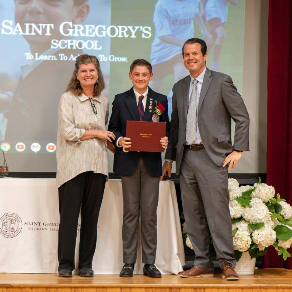 SGS student receiving his diploma at 8th grade graduation