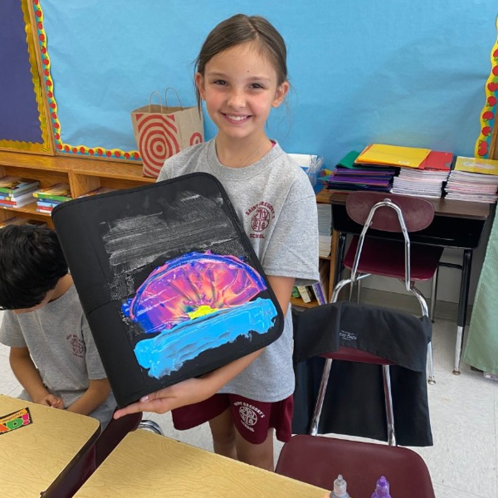 Saint Gregory's School student showing her art