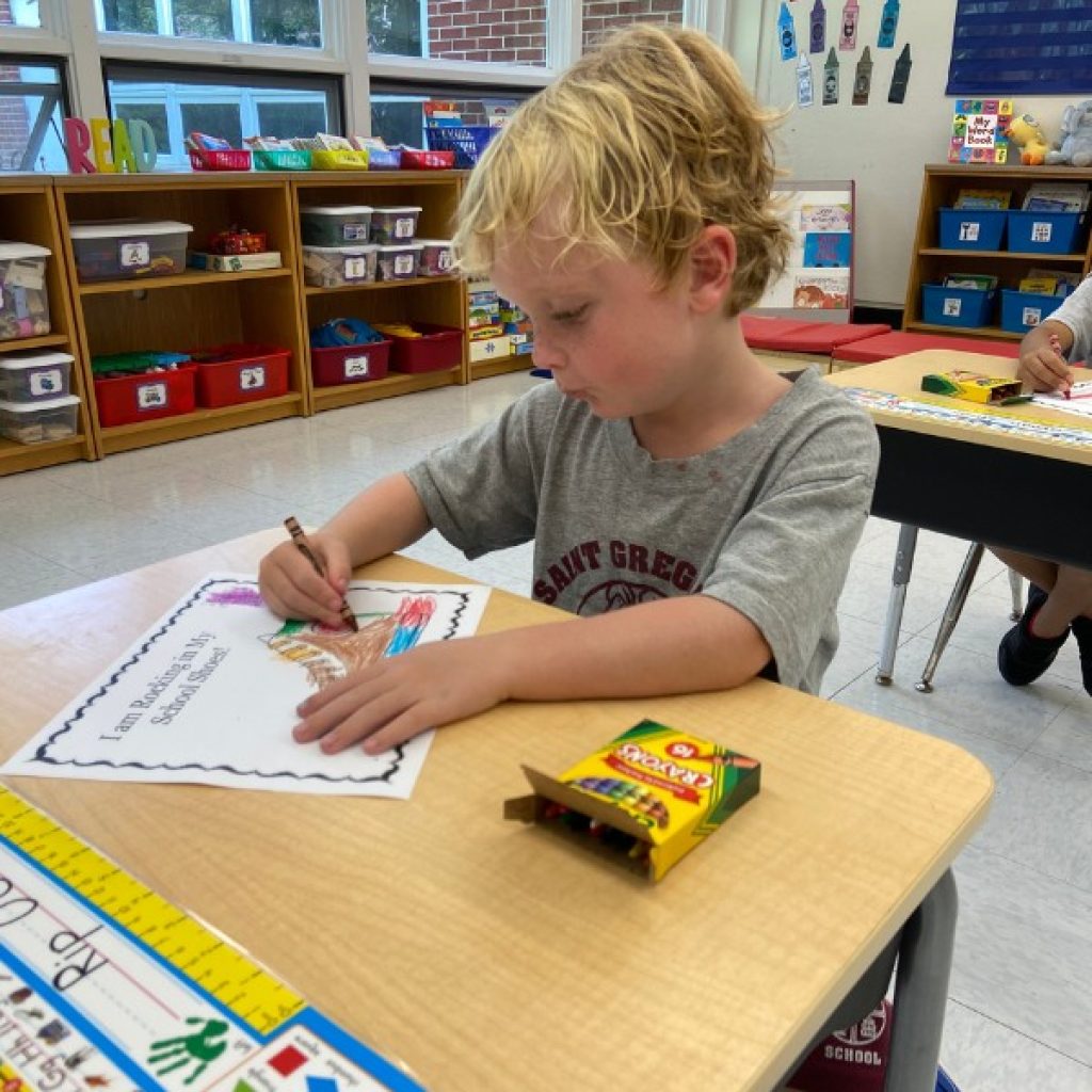 Saint Gregory's School student drawing with crayons