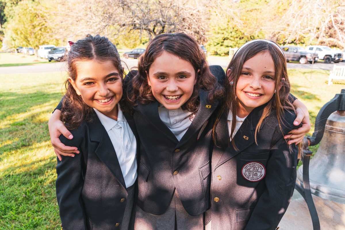 private school students smiling in the camera at Saint Gregory's School in Loudonville, NY