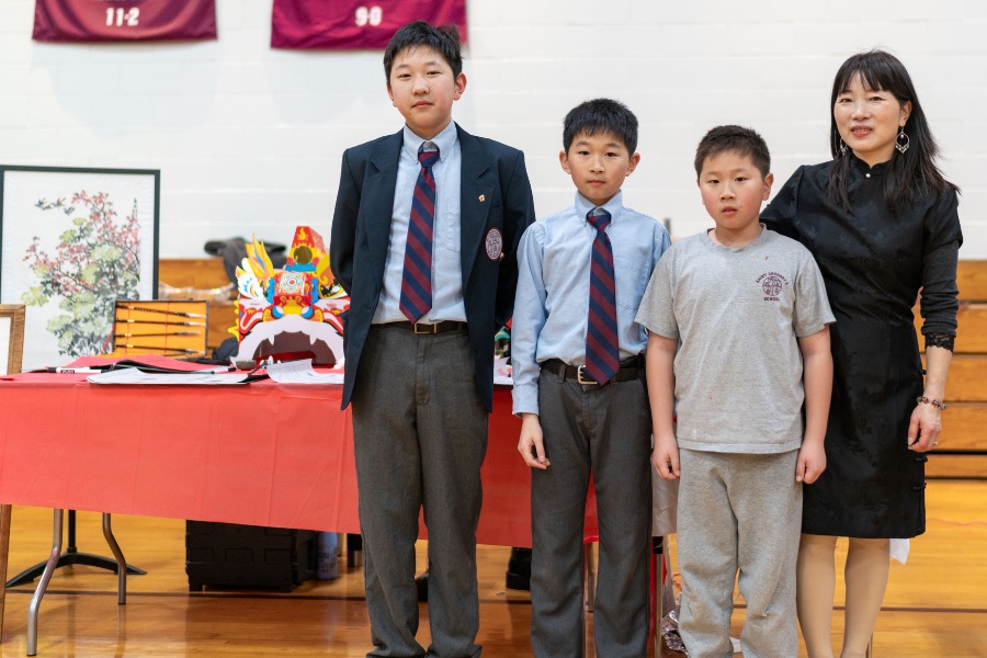 Saint Gregory's School students Yao, Ian and Tao represent China together with their mom at the second annual multicultural fair at SGS