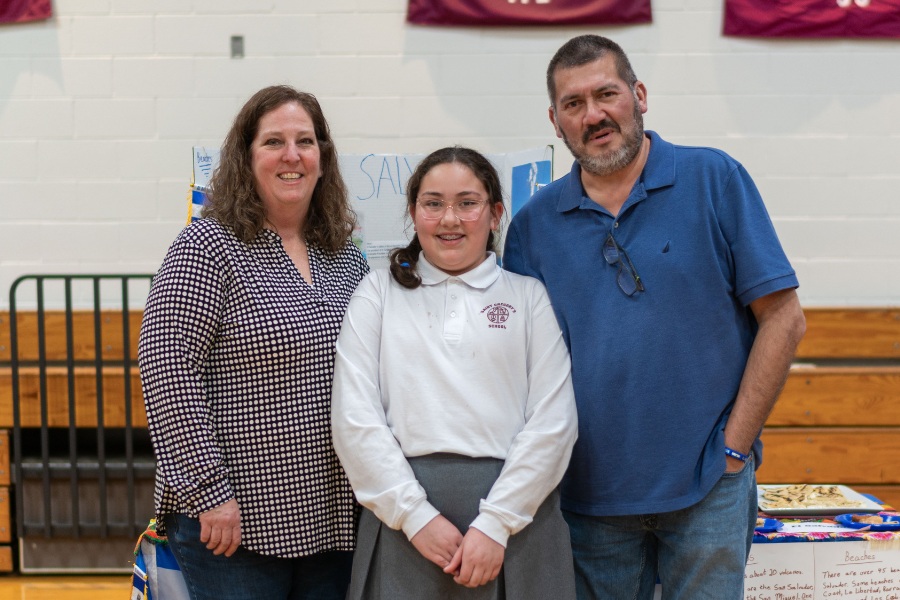 Saint Gregory's School student Sophia represents El Salvador together her parents at the second annual multicultural fair at SGS