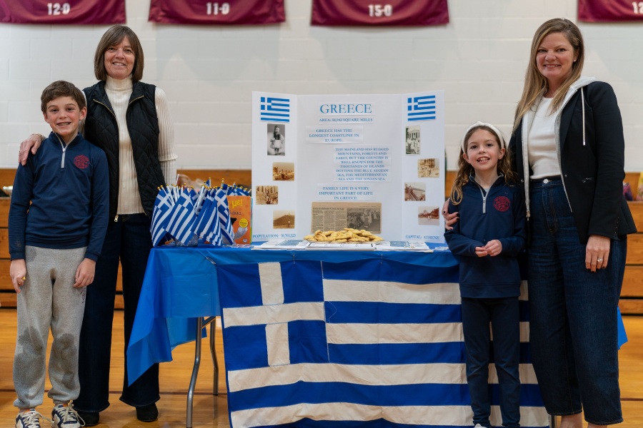 Saint Gregory's School students Ronan and Ava represent Greece together their mom and grandmother at the second annual multicultural fair at SGS