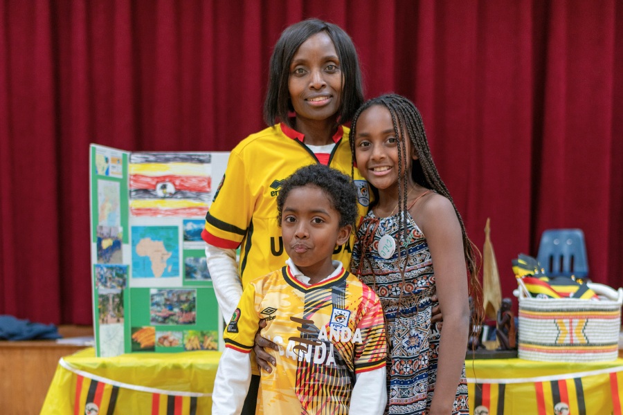 Saint Gregory's School students Tara and Theeran represent Uganda together with their mom at the second annual multicultural fair at SGS