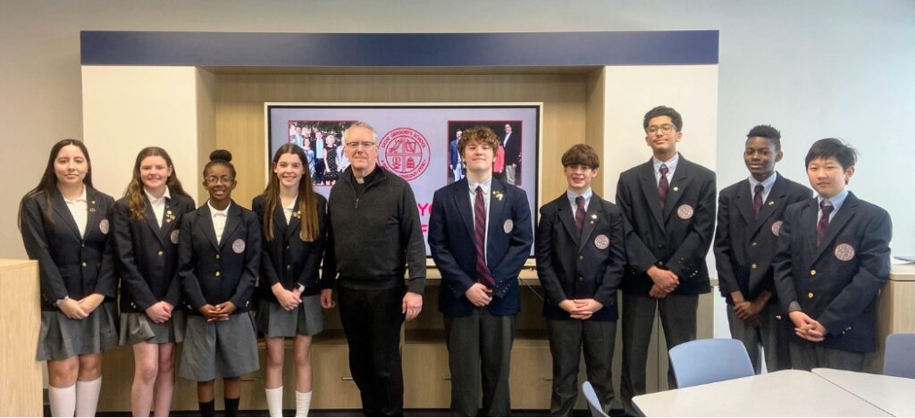 Private School 8th graders with Father Vosko at the Raymond Family Tech Lab Dedication