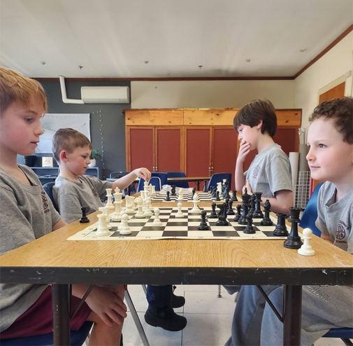 private school students playing chess the Saint Gregory's School in Loudonville, NY