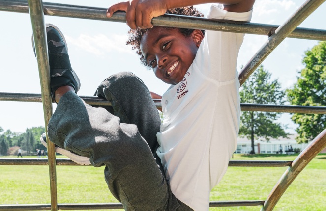 private school student climbing at the Saint Gregory's School campus