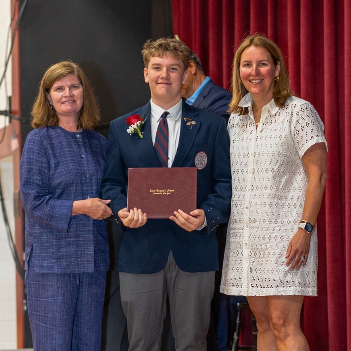 SGS student Austin receiving his diploma