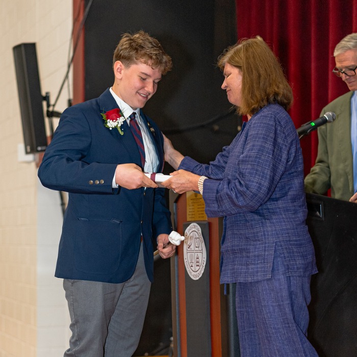 private school 8th grader Austin receiving an award on stage