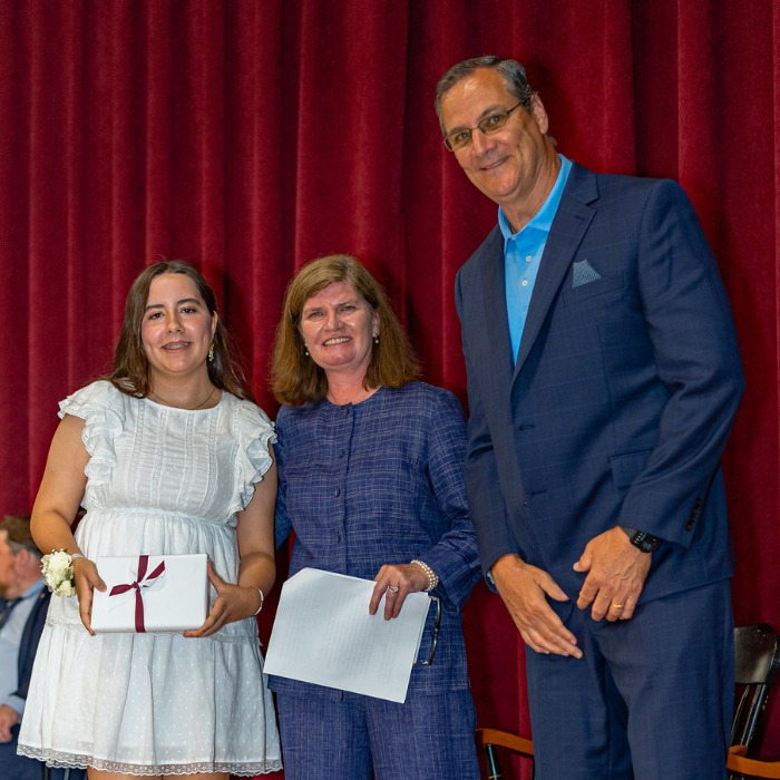 SGS private school student Eden receiving the Faculty Award for Excellence in Research and Rhetoric