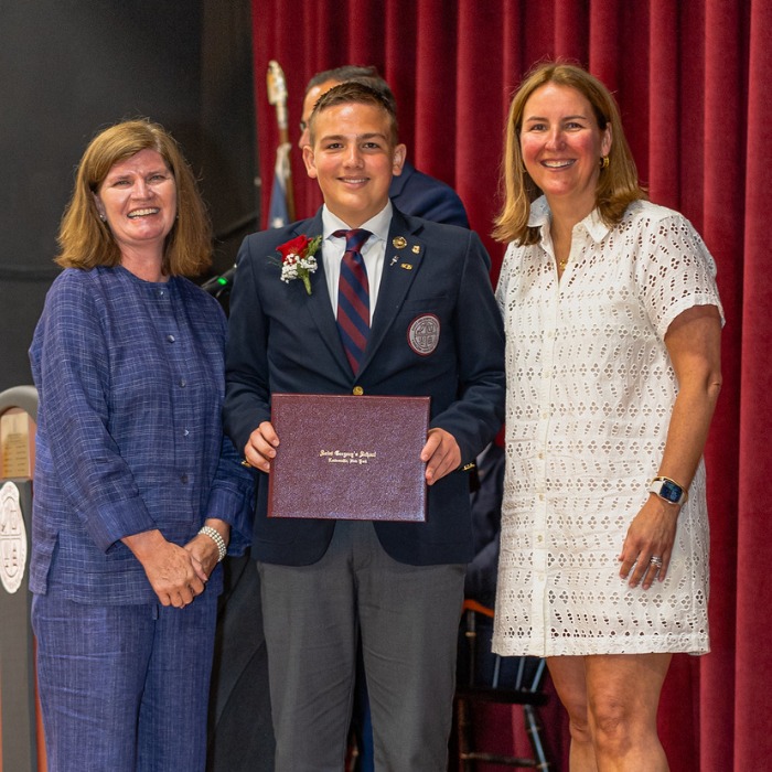 SGS student Evan receiving his diploma