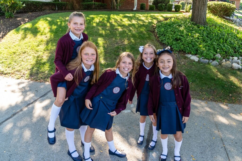 private school students smiling in the camera on the SGS campus in Loudonville, NY