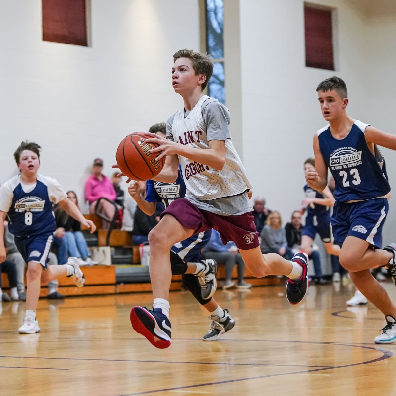 private school students playing basketball for Saint Gregory's School's boys basketball team in Albany, NY