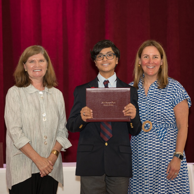 private school 8th grader Ali receiving an award on stage of Saint Gregory's School in Loudonville, NY