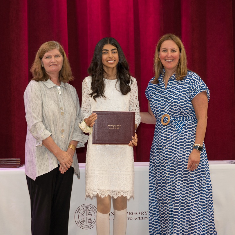 private school 8th grader Aleeza receiving an award on stage of Saint Gregory's School in Loudonville, NY