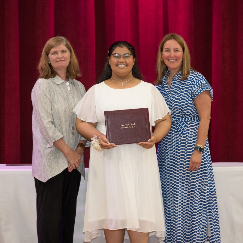 private school 8th grader Khloe receiving an award on stage of Saint Gregory's School in Loudonville, NY