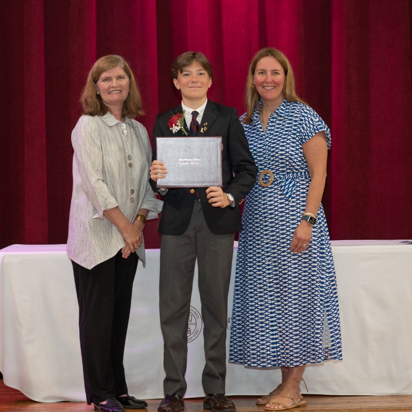 private school 8th grader Marshall receiving an award on stage of Saint Gregory's School in Loudonville, NY